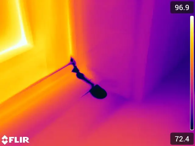 Thermal image of moisutre leaks at doors and windows