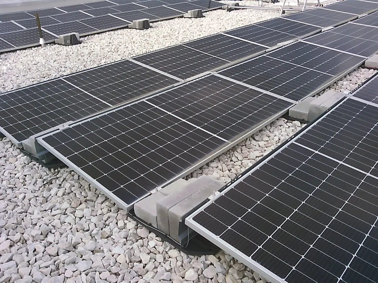 Solar panels mounted on building roof thermal imaging